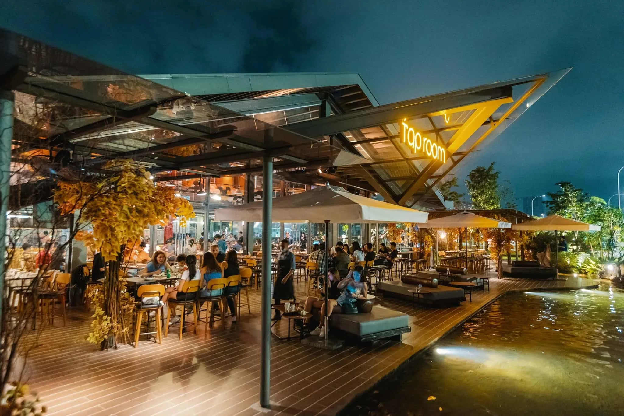 Tap Room KL glasshouse beside the waterfall at night